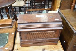 A Victorian hand crank Singer sewing machine in wooden carry case