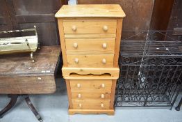 A pair of natural pine three drawer bedside chests