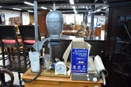 A selection of vintage photographic equipment including enlarger, developing trays and guillotine