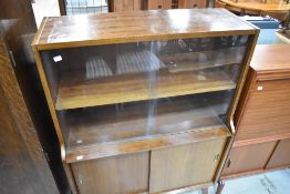 A 1970s Sapele display cabinet with cupboard below
