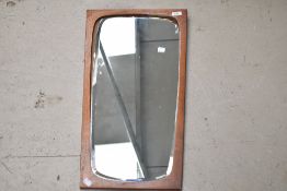 A vintage teak mirror