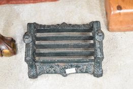 A cast iron boot scraper