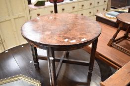 An early 20th Century burr wood coffee table of circular form