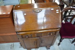 An early to mid 20th Century oak bureau