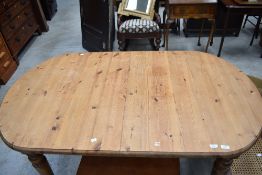 A modern pine oval dining table