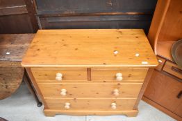 A modern pine chest of two over two drawers