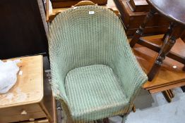 A vintage Lloyd Loom tub chair