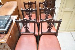 A set of six Victorian dining chairs with carved vase backs