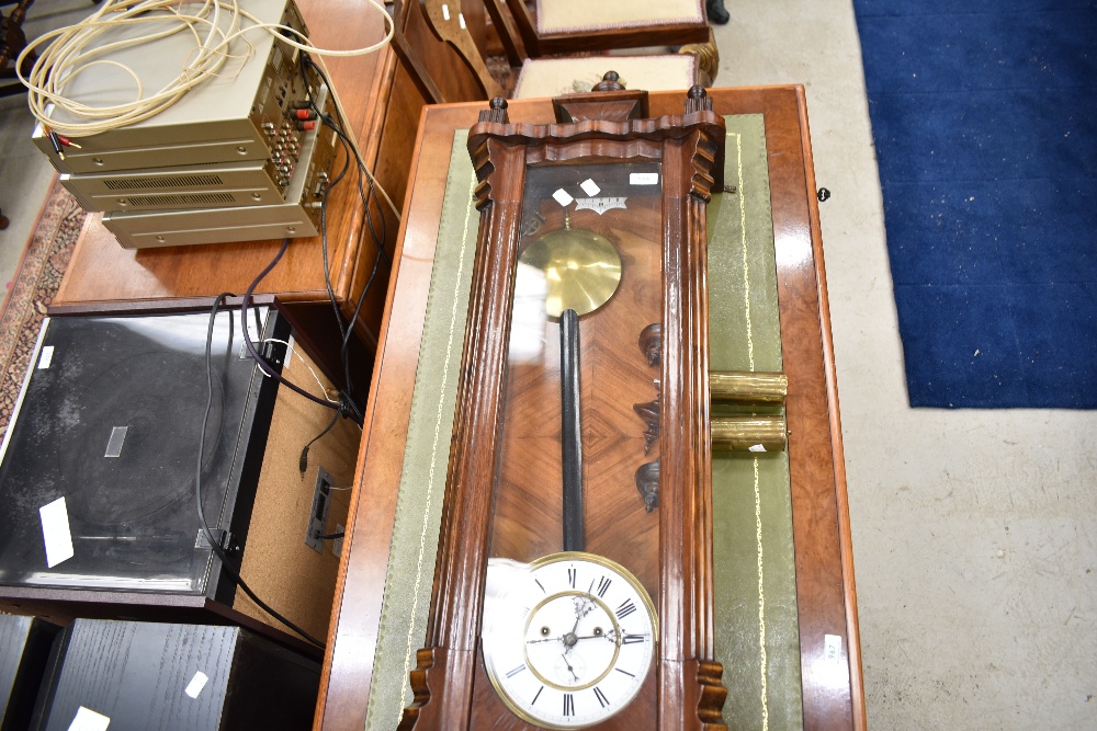 A traditional mahogany cased Vienna wall clock