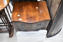 A reproduction Regency serpentine front chest of three bedroom drawers