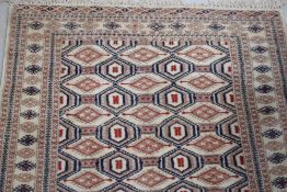 A traditional Persian style rug having cream ground with blue and red tones, approx. 160 x 96cm