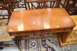 A nice quality reproduction yew wood console table having double frieze drawer