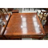 A modern yew wood square coffee table of large proportions