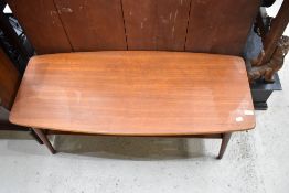 A vintage teak coffee tables having slatted undertier