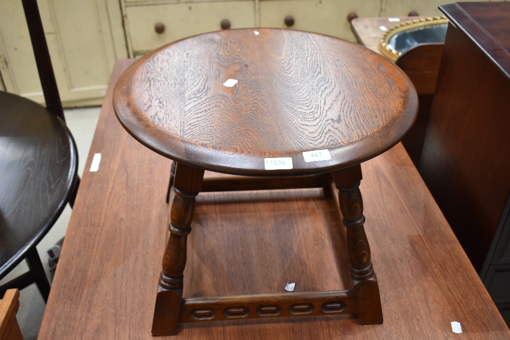 A Priory style coffee table, having circular top