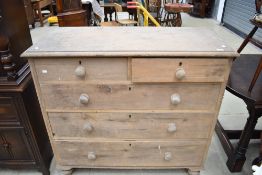 A Victorian stripped chest of two over three drawers