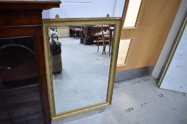 A modern gilt frame wall mirror