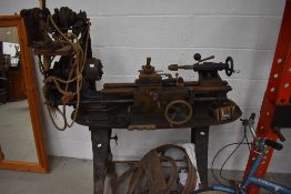 A vintage lathe and accessories