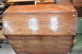 A 19th Century mahogany bureau of wide proportions having fitted interior