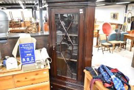 A reproduction mahogany corner display