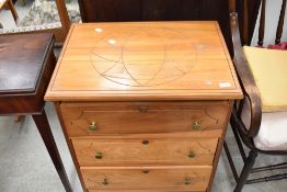 An Oriental style three drawer chest , on castors, with geometric pattern to top