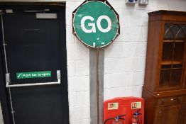 A traffic management manual stop/go sign