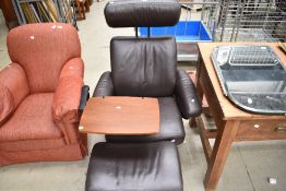 A modern brown leather Stressless armchair with footstool
