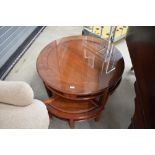 An Oriental hardwood coffee table nest