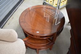 An Oriental hardwood coffee table nest