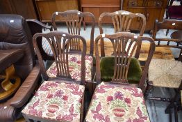 A set of four Georgian mahogany dining chairs