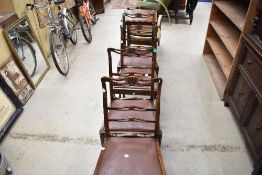 A set of four early 20th Century stained frame dining chairs