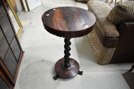 A William IV rosewood occasional table having twist column