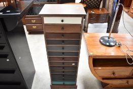 A narrow chest of drawers, designer style