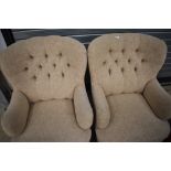 A pair of modern button back armchairs