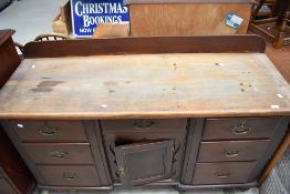 A Victorian stained frame sideboard having stripped top