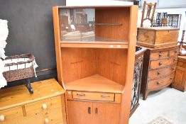 A vintage teak G plan corner display with drawer and double cupboard under