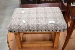 A reproduction footstool in the Arts ad Crafts style