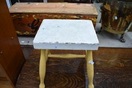 A traditional painted stool having 'H' frame