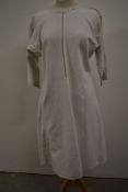 An antique French linen Chanvre biaude smock or shirt with singular button to neck and tiny hand