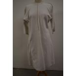 An antique French linen Chanvre biaude smock or shirt with singular button to neck and tiny hand