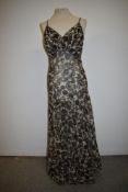 A stunning 1930s floral bias cut cotton tulle gown having self covered buttons to back, lined in
