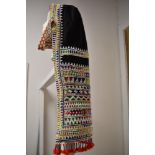 A vintage Bedouin tribal head dress, having extensive glass beading throughout and tassel