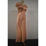 A 1940s Art Deco nightdress having lace detail to neckline, hem and fluted sleeves.