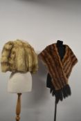 A vintage fur cape and a fur wrap having mink tails.