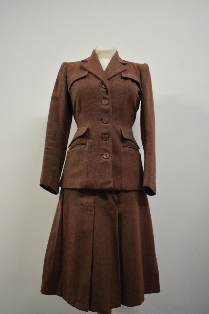 A 1940s Pandem model beige and cranberry wool herringbone ladies suit comprising of jacket and
