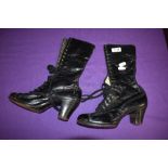 A pair of black late 19th/ early 20th century lace up boots having stack heel.
