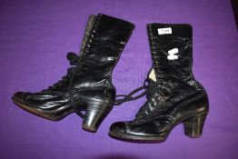 A pair of black late 19th/ early 20th century lace up boots having stack heel.