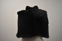 A 1930s black fur cape.