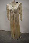 A 1940s Marshall and Snelgrove Southport wedding dress with sweetheart neckline, sash belt to waist,