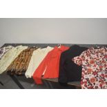 Seven vintage ladies tops and blouses in vibrant patterns, various sizes and styles.